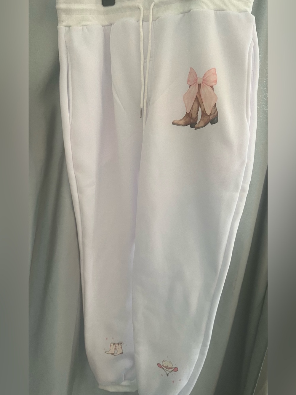 White Women's Jumpsuit with Pink Bow & Boot Graphic